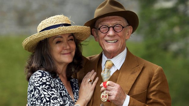 Sir John Hurt poses with his wife Anwen after being awarded a knighthood by Queen Elizabeth II during an Investiture ceremony at Windsor Castle, 2015. 