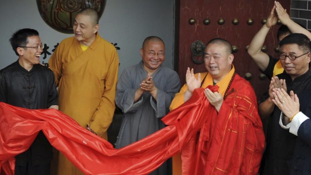 Claims against him: Shi Yongxin, third from right, in the red and yellow robes.