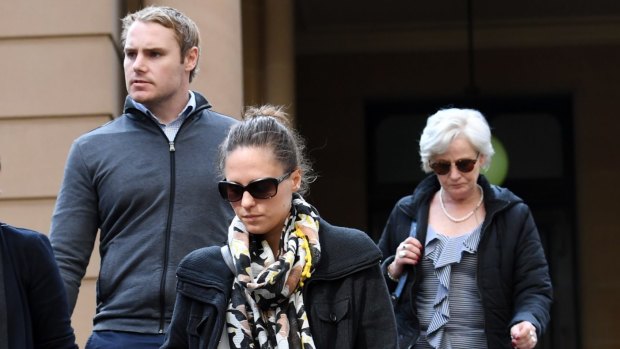 Adam Cranston's wife, Elizabeth (centre), mother Robyn (right) and brother Josh leave Sydney Central Local Court on Thursday.