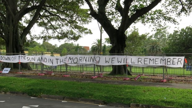 A banner protesting the removal of trees along Anzac Parade. 