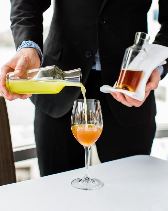 An aperitif of house-made elderflower tonic is topped with a bracing flush of fresh cucumber and parsley juice at Quay.