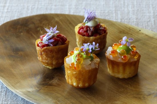 Pie tee shells of carrot waste filled with delicately smoked salmon.