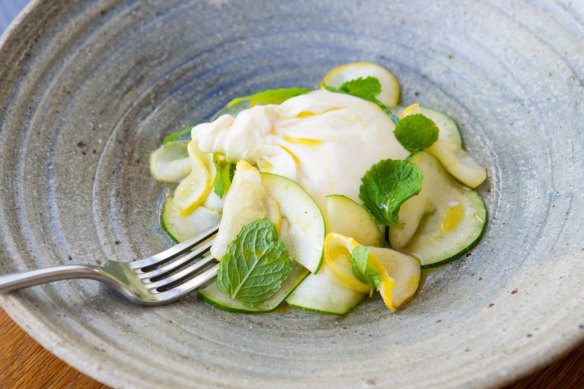 The creamy local burrata is ringed with a delicate zucchini, squash and mint salad.