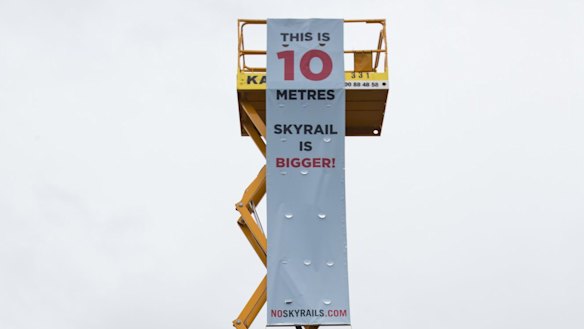 A 10-metre crane was raised to show how an elevated rail line would affect locals.