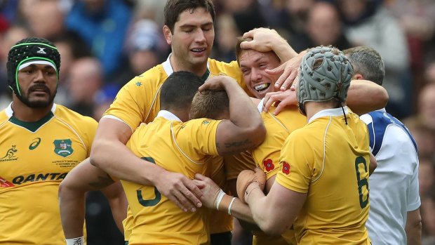 Reece Hodge celebrates after he scores Australia's first try of the game.