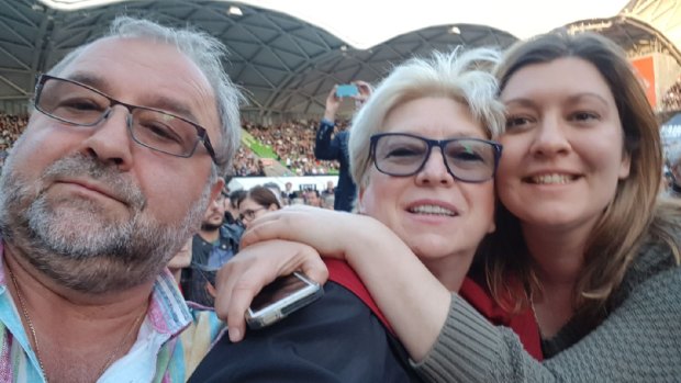 Sasha Petrova and her parents at the McCartney concert.