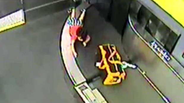 A toddler went on a wild ride through the baggage conveyor belt at an airport in the US.