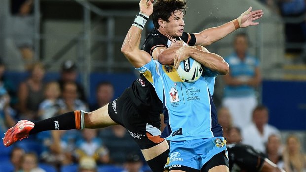 Clothesline: Mitchell Moses catches William Zillman high in a combustible moment at Robina.