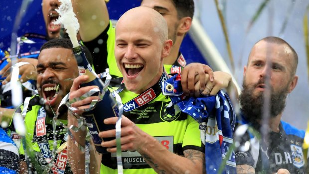 Huddersfield Town's Aaron Mooy celebrates winning the Sky Bet Championship play-off final at Wembley Stadium, London. Photo: Mike Egerton/PA Images 