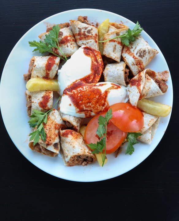 Beyti tantuni, wrapped in think pastry-like bread.