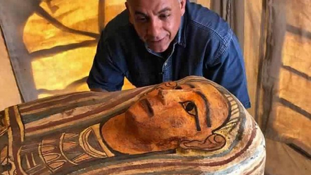 
Mostafa Waziri, secretary general of the Supreme Council of Antiquities, with one of more than two dozen ancient coffins.