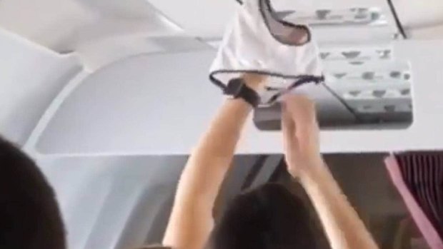A passenger airs our their underwear.