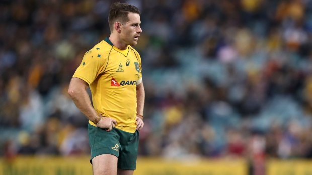 Dejected: Bernard Foley at full-time after the Wallabies' shock loss to Scotland.