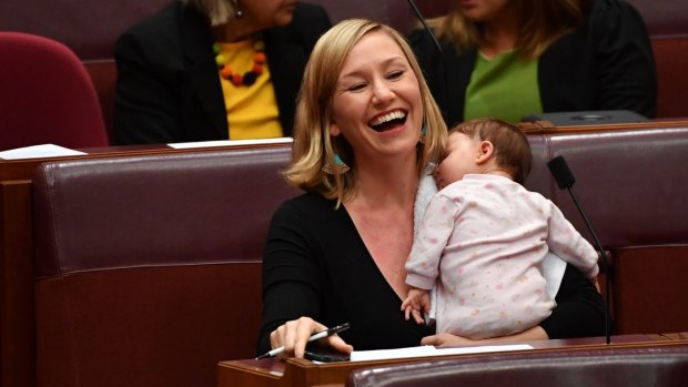 Greens co-deputy leader Larissa Waters soothes baby Alia Joy after breastfeeding her in the Senate.