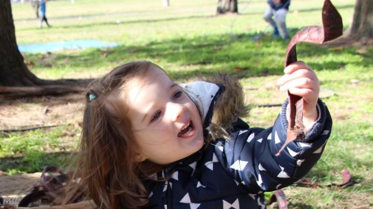 Two Canberra children enjoy playing outside at the Nature Play CBR launch on Thursday.