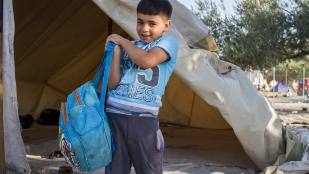 Omran, 6, fled Syria with his family carrying only this bag.