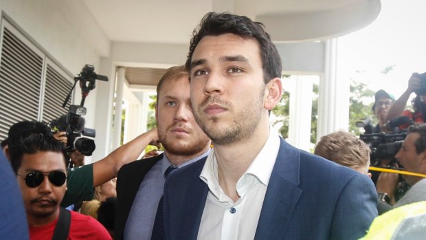 Branden Stobbs, front, and Thomas Laslett arrive at the Sepang Magistrate in Sepang, Malaysia.