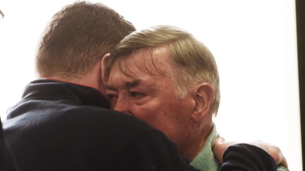 Barry Lyttle reunited with his father Oliver, outside Central Local Court, after being released on bail in January.