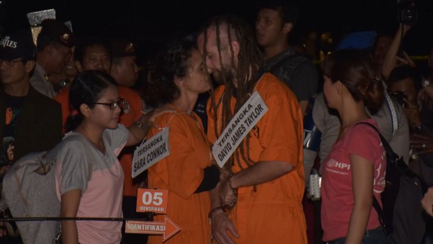 Sara Connor and David Taylor recreate a kiss on the beach during a reconstruction of the death of a police office in Bali.