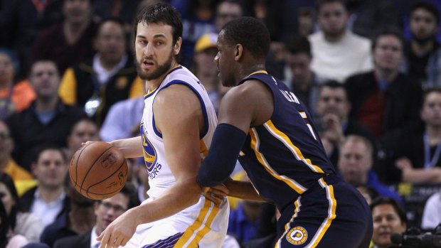 Back on court: Andrew Bogut posts up against Indiana's Lavoy Allen in Oakland, California.