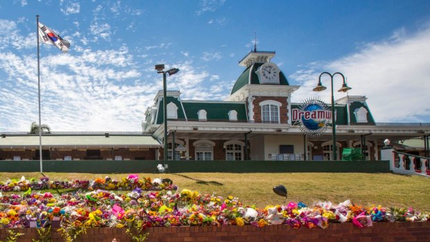 Floral tributes outside Dreamworld where the deaths of four people have raised questions about workplace laws in Queensland and prompted a safety review of the state's theme parks.  