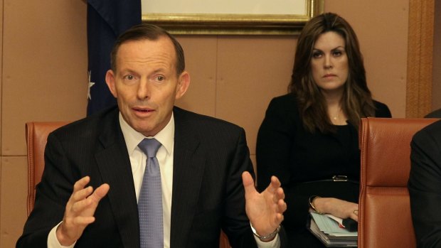 Prime Minister Tony Abbott with his chief of staff Peta Credlin during the Council of Australian Governments.