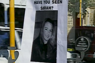 A missing person poster on the public phone booth where Sarah Spiers called for a taxi before she vanished. 