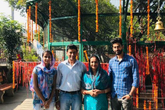 Australian permanent resident Pragya Chandel (second from left), his wife and two adult children were knocked back from the first repatriation flight out of Delhi after three of the four family members tested positive.