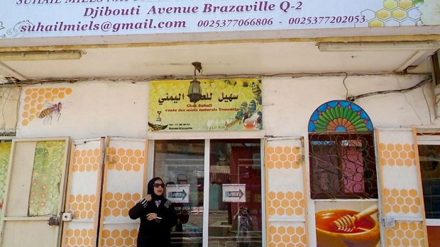 Afrah Suhail stands outside her shop near the bustling central market of Djibouti's capital. 