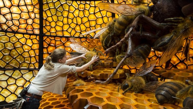 Project supervisor Mona Peters works on the Japanese bee installation, one of the more popular Bug Lab exhibits.