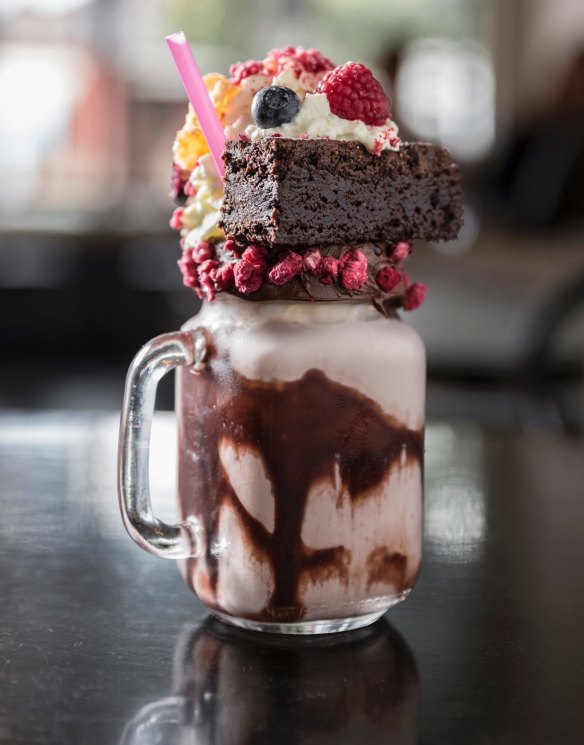 A freakshake featuring a fudge brownie, white chocolate mousse and Nutella layers with freeze-dried fruit from Naughty Boy Cafe.