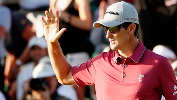 Electrifying finish: Justin Rose of England celebrates after a birdie putt on the 18th hole.