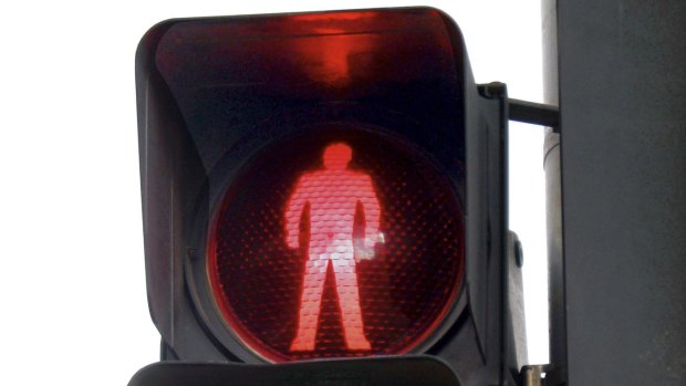 Drivers face longer waits at red lights under the pedestrian safety plan.