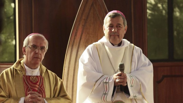 Bishop Juan Barros, right, in the cathedral in Osorno.