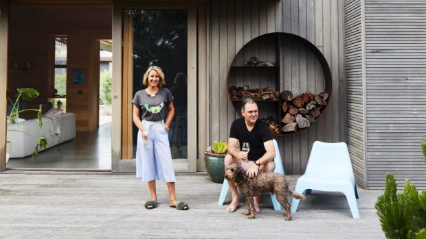“I can’t help but notice the change of pace and clean air after Melbourne all week,” say Julia, here relaxing on the rear deck with Adam and Mr Wolf.