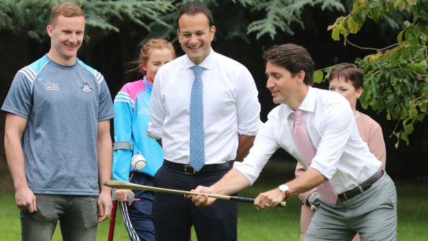 Second calling: Canadian Prime Minister Justin Trudeau tries out a Hurling stick in the grounds of Farmleigh House in Dublin.