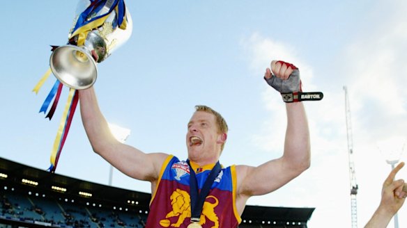 Hat-trick: Michael Voss and the Lions celebrate in 2003.