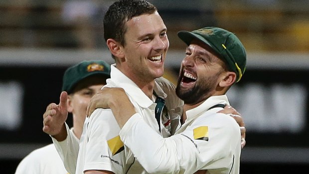 Josh Hazlewood is congratulated by Nathan Lyon after dismissing Wahab Riaz.