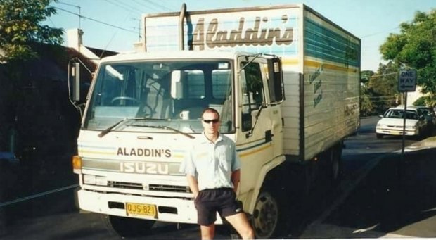Sydney life: Macedo, around 2000, while working as a driver for Sydney based commercial laundry firm Aladdin's.