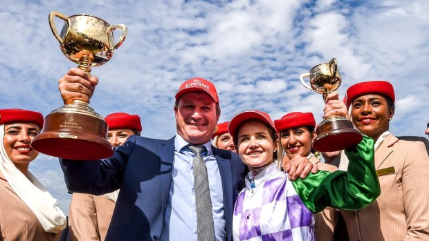 Winners are grinners: Darren Weir and Michelle Payne celebrate their Melbourne Cup win in 2015. 