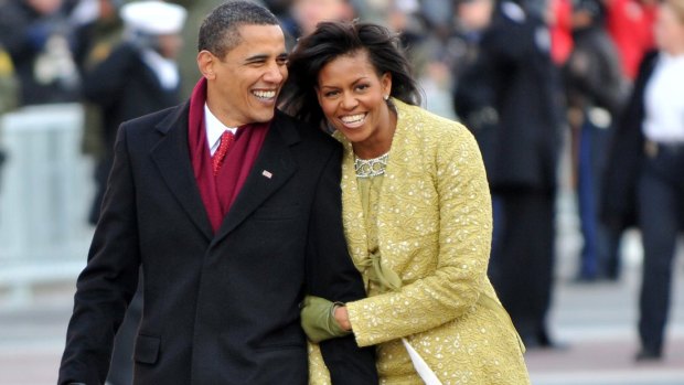 President Barack Obama and first lady Michelle Obama walk in the Inaugural Parade on January 20, 2009 in Washington, DC.