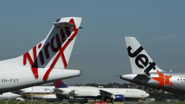 Dozens of domestic flights were grounded at Sydney Airport on Thursday due to high winds. 