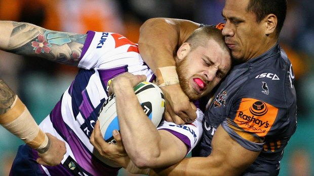 Storm's Cameron Munster attending fullback finishing school against Wests Tigers in round-21.