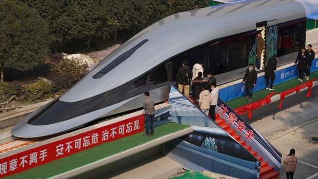 People visit a prototype magnetic levitation train developed with high-temperature superconducting (HTS) maglev technology during the launch ceremony in Chengdu.