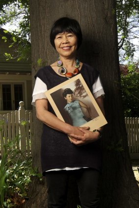 Wanted to be Aussie: Gabrielle Wang's great-grandfather came from China to the Victorian goldfields in the 1850s. She is holding a hand-coloured photograph of her mother.