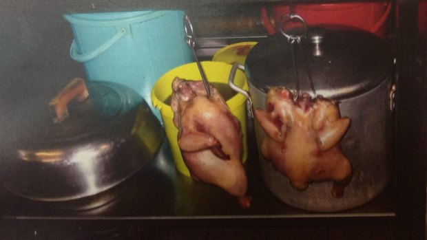 Cooked chickens hanging from shelving at Red Emperor, as pictured in photographs shown to the court.