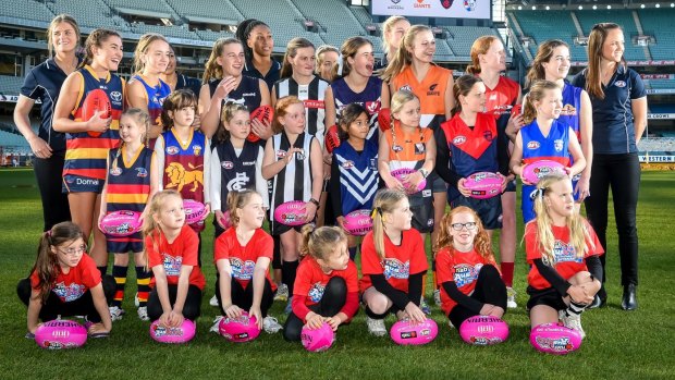 Daisy Pearce (far right) with fellow players and potential future stars at the launch of the AFL women’s league on Wednesday. 