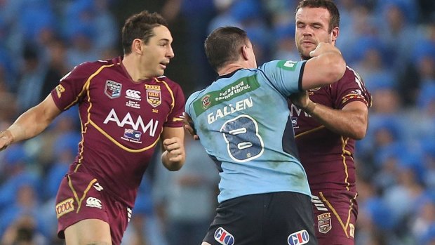 The punch that changed the game: Paul Gallen collects Nate Myles during the 2013 Origin series. Punching was banned after that incident.