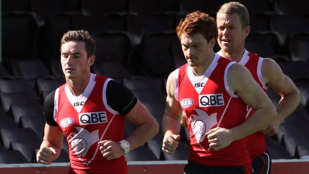 Blossoming friendship: Jed Lamb and Gary Rohan train for the Swans with Ryan O'Keefe in 2013.
