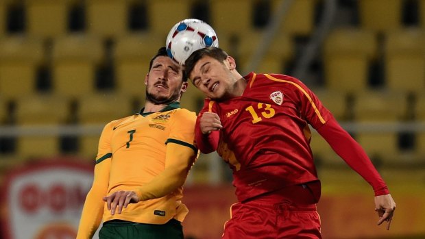 Mathwe Leckie of Australia and Stefan Ristovski of FYR Macedonia go up for a header during the International Friendly in Skopje on Tuesday.
